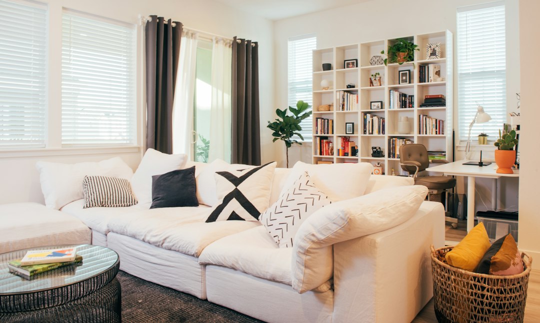 Comfortable living room showing pillows and blankets within a defined seating area