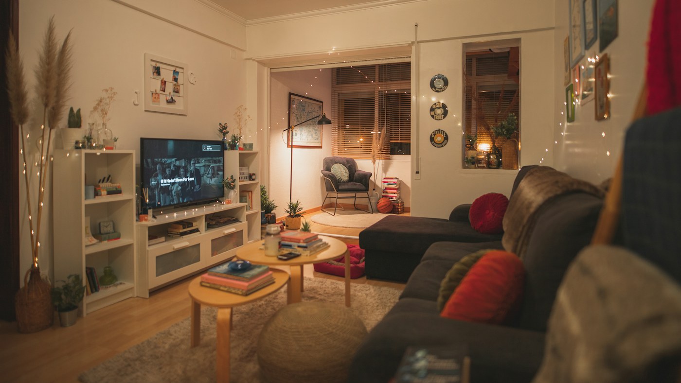Living room restored to everyday use after an overnight guest setup