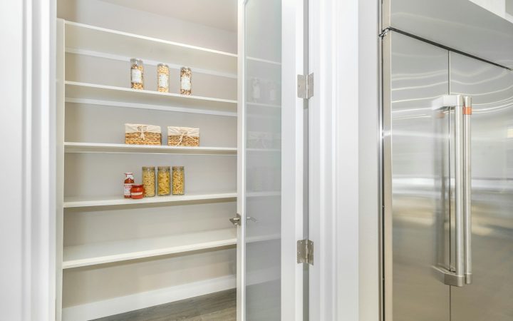 Organized pantry shelves showing visible household food inventory