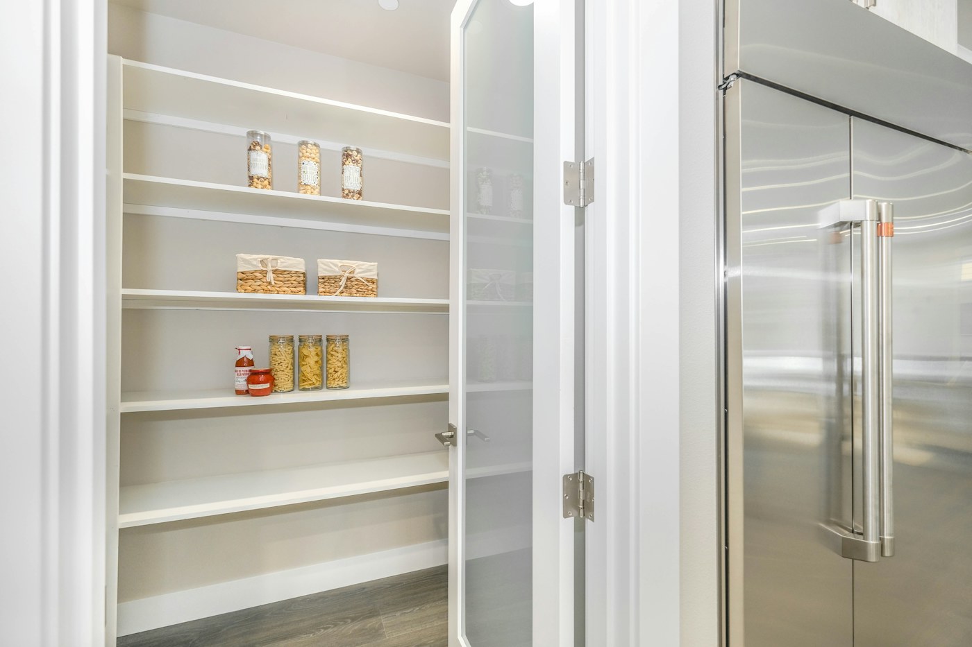 Organized pantry shelves showing visible household food inventory