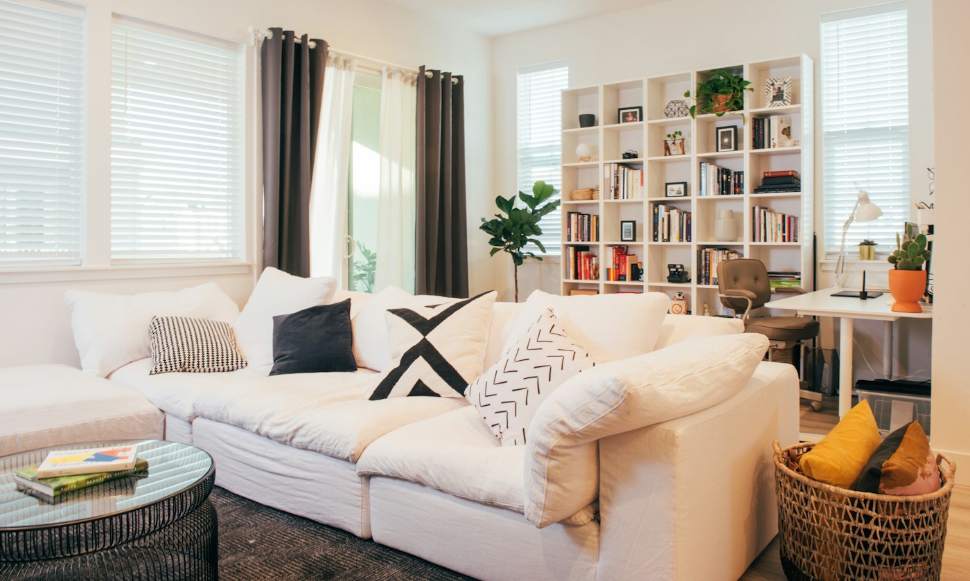 Living room seating and soft goods illustrating concentrated textile maintenance