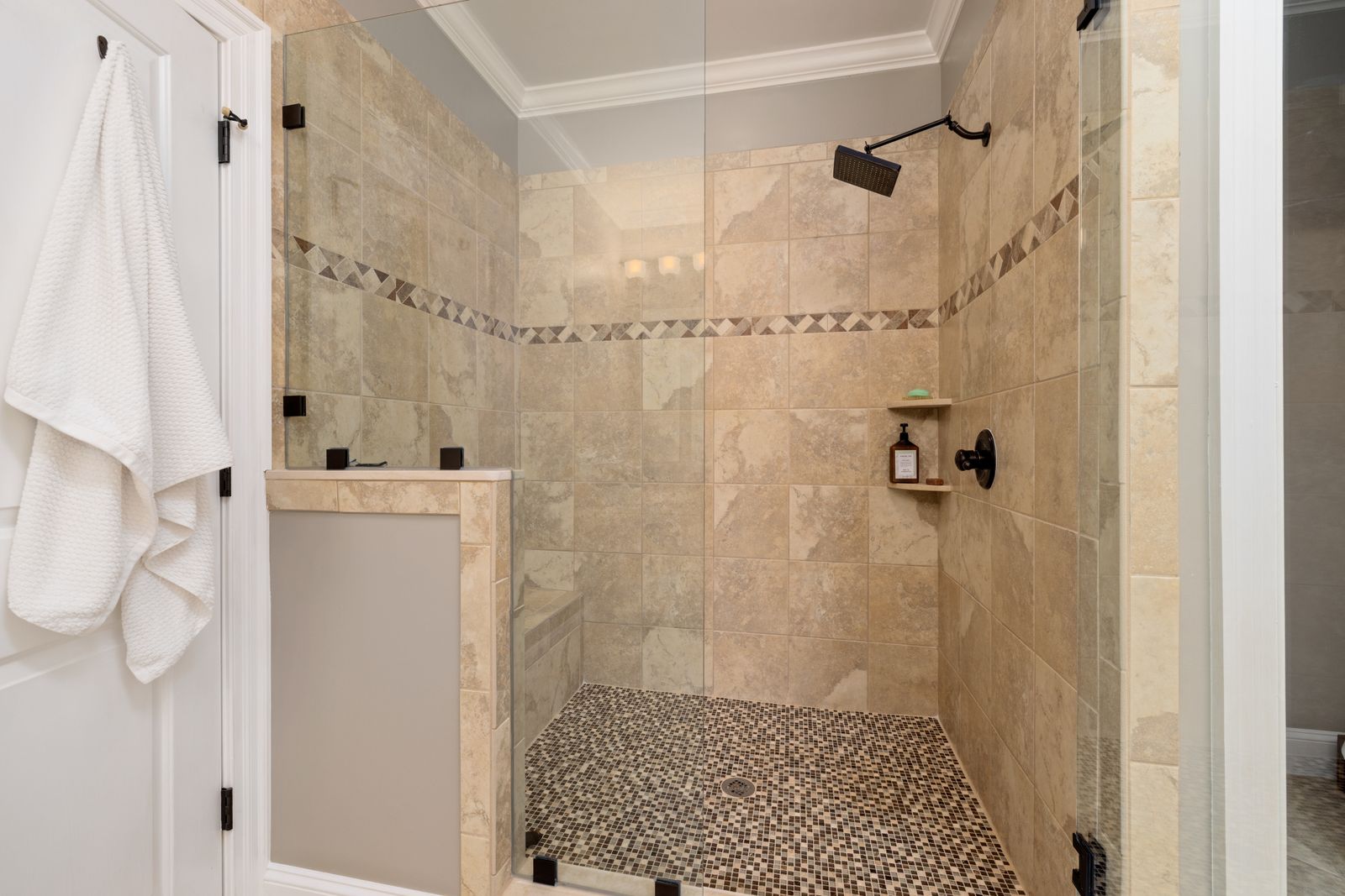 Tiled shower with glass enclosure