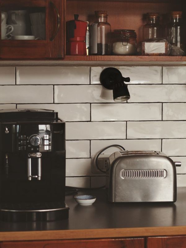 Compact kitchen counter with a coffee maker and toaster showing the space used by everyday appliances