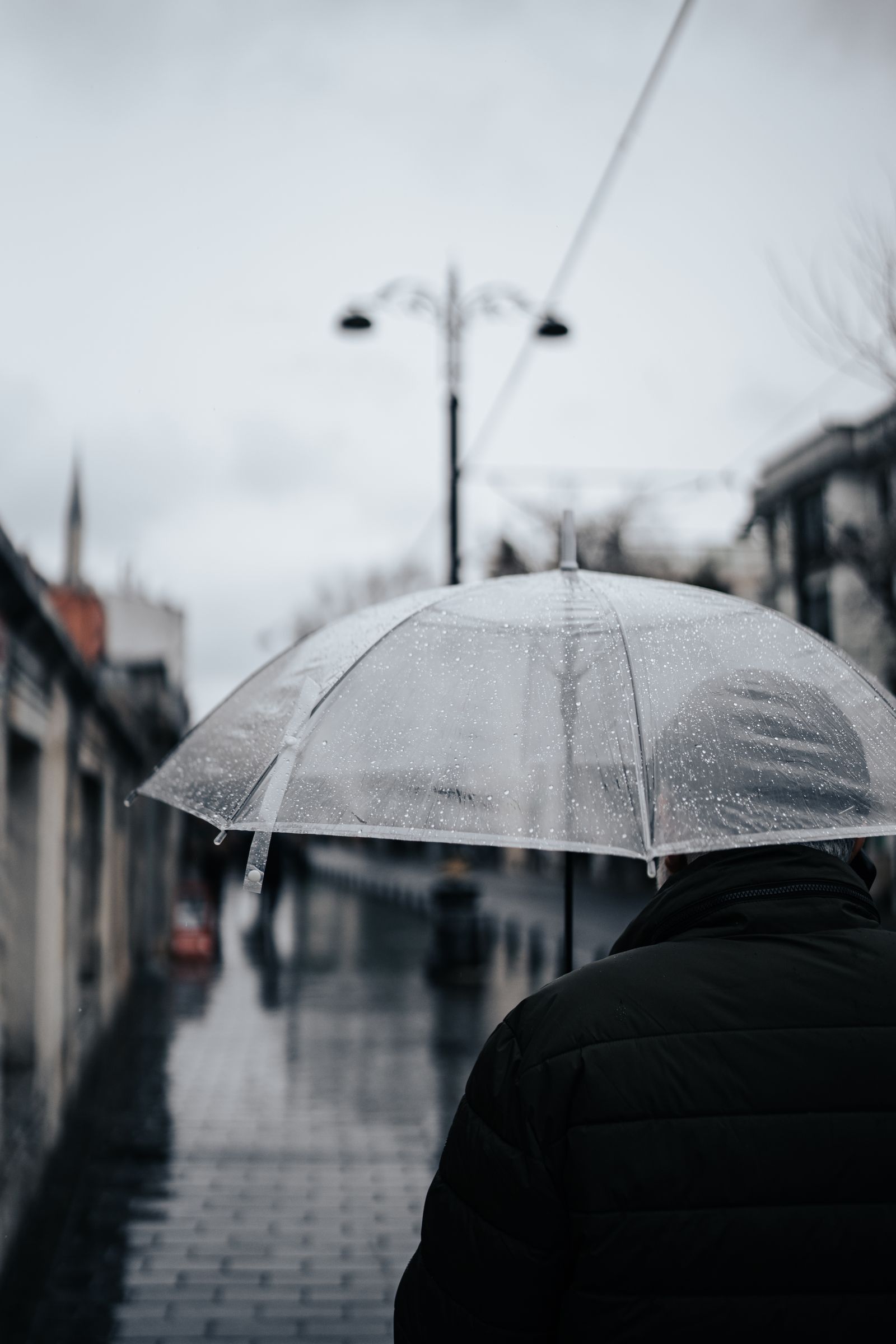 Walking with an umbrella on a rainy day