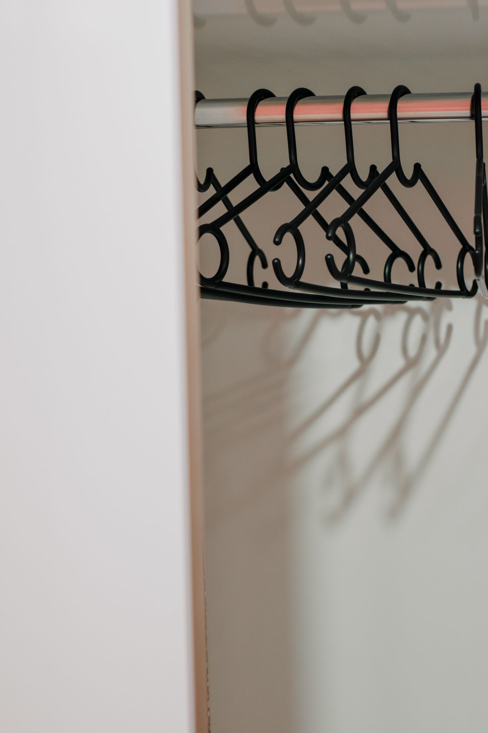 Close view of hangers in a wardrobe