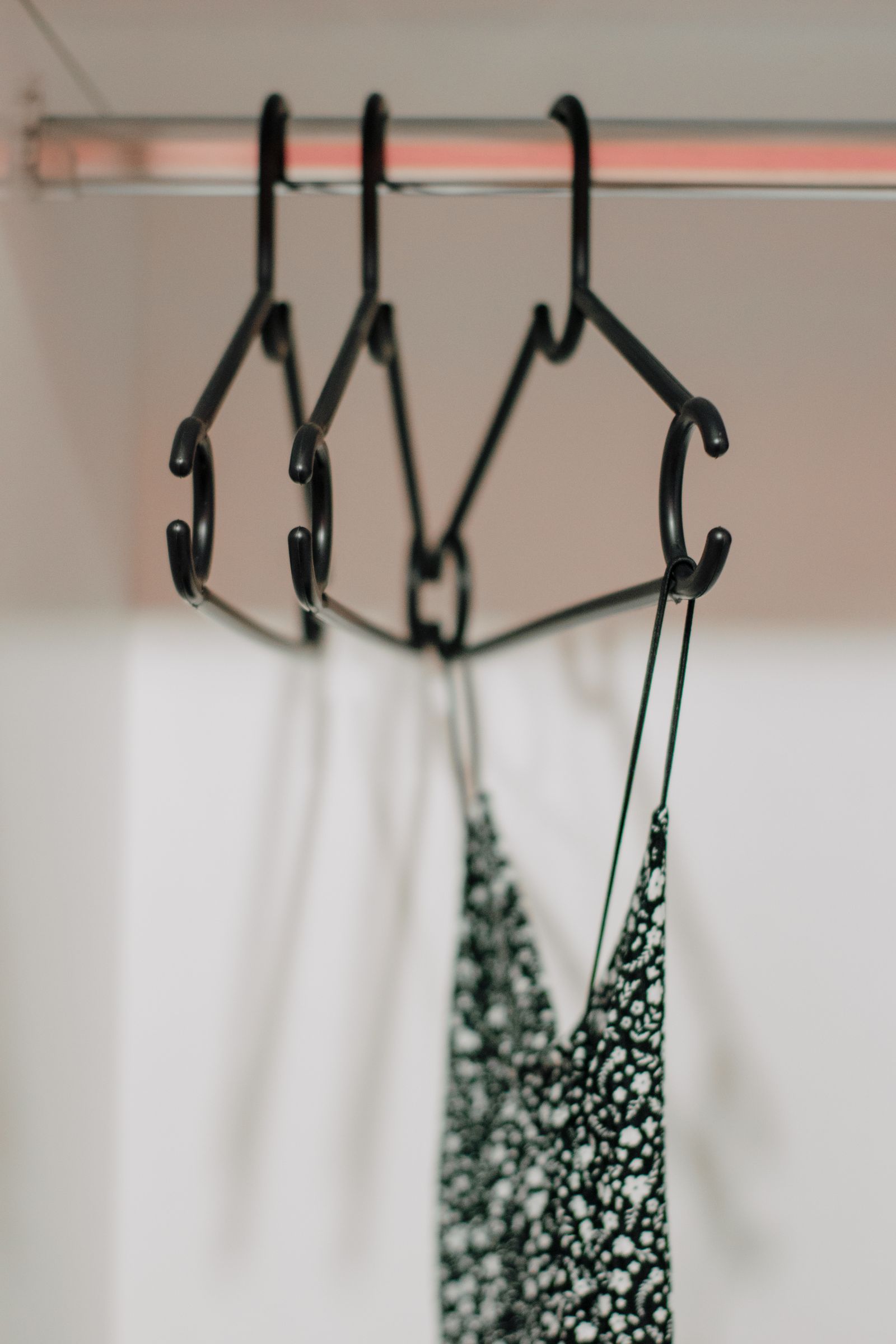 Clothes hanging in a wardrobe