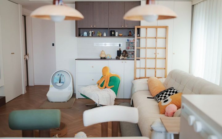 Modern family living room with comfortable seating and a small number of visible plush toys