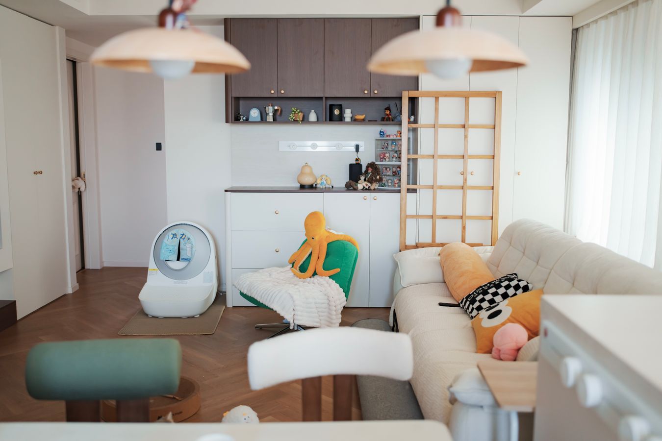 Modern family living room with comfortable seating and a small number of visible plush toys