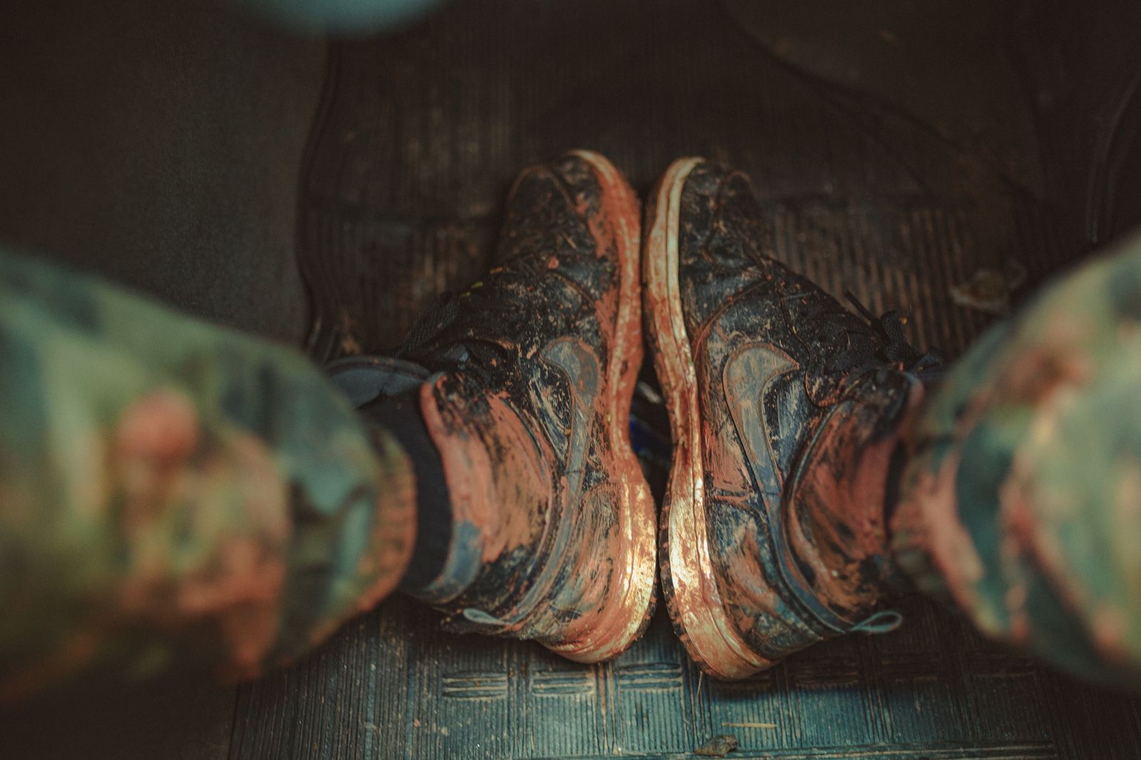 Close-up of muddy sneakers after outdoor use