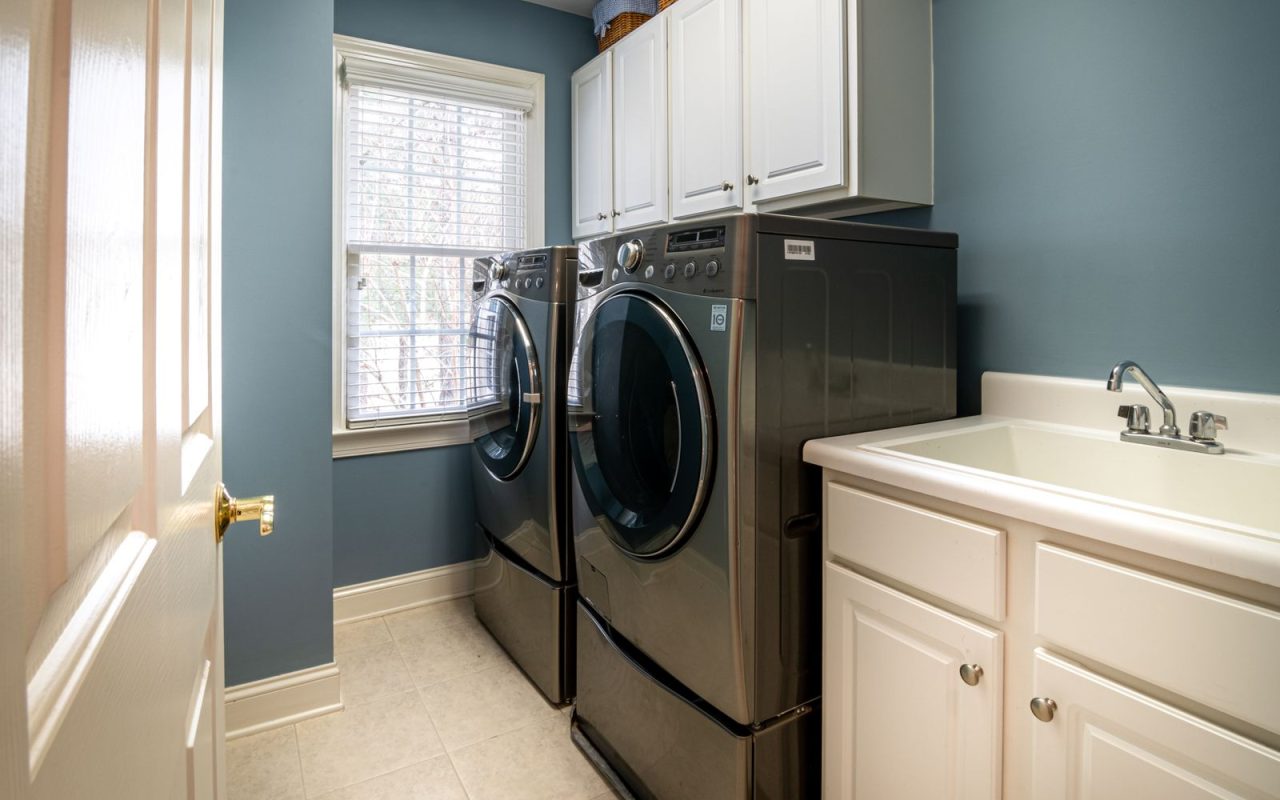 Front-load washer in a clean organized laundry room