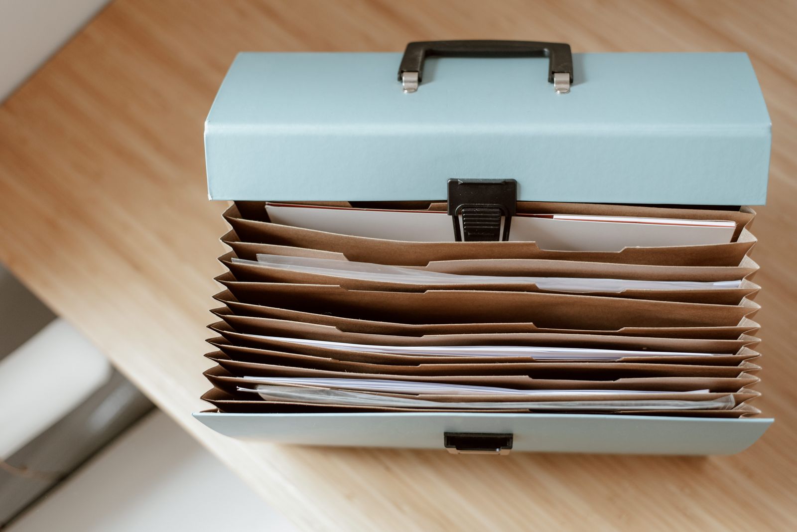 Accordion folder filled with organized household documents