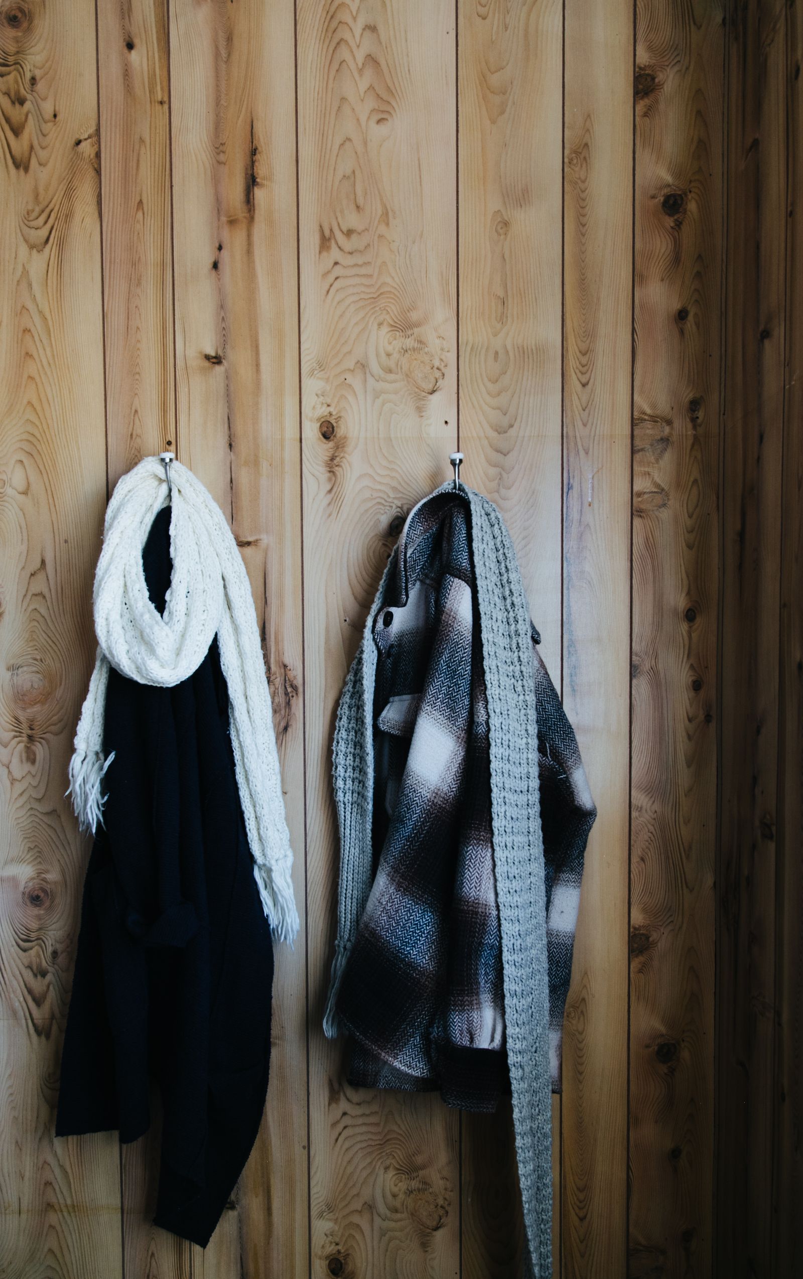 Clothes hanging on wall hooks