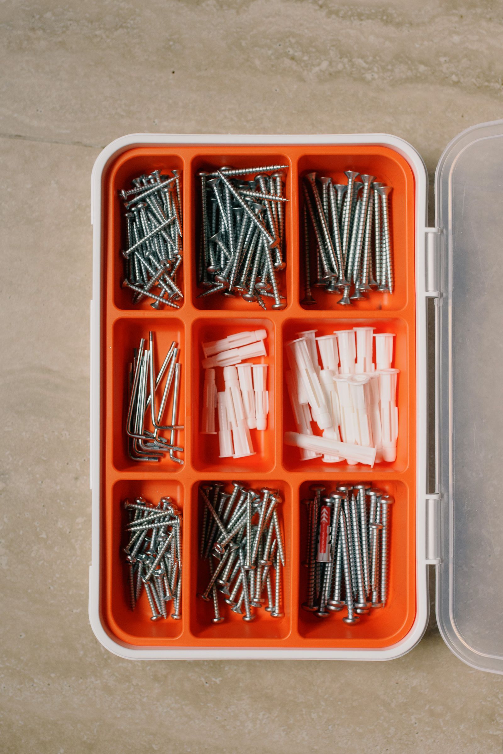Screws and fasteners sorted into organizer compartments
