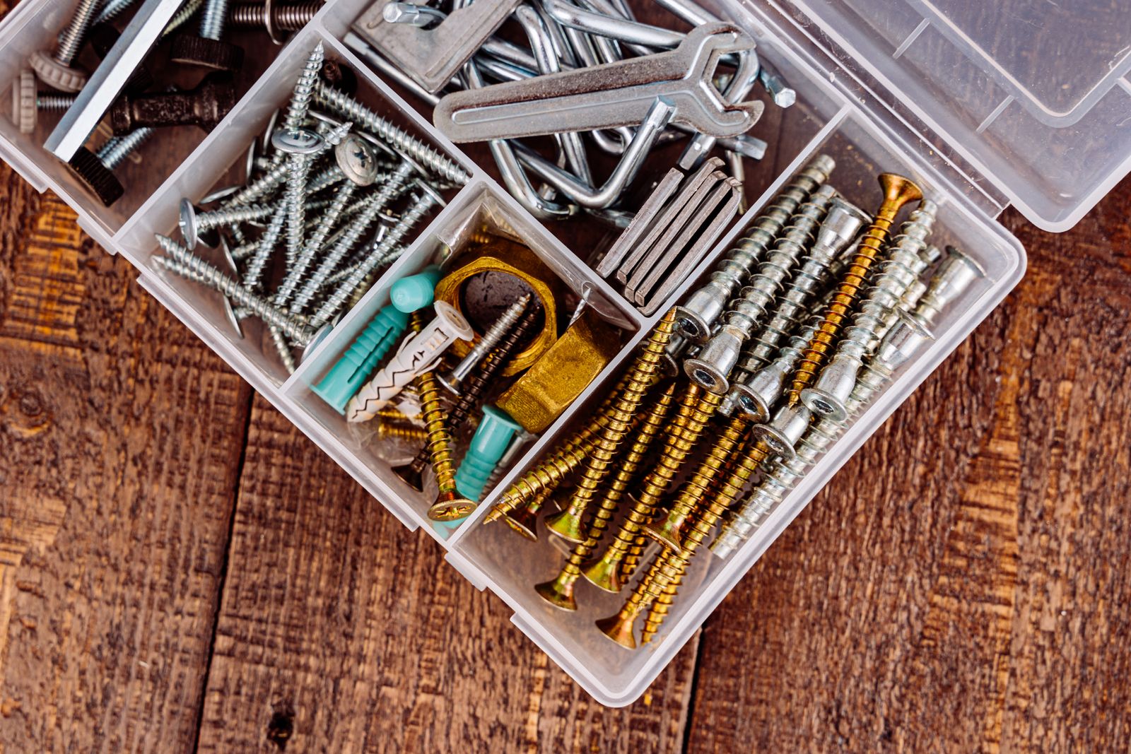 Top view of tools and screws in an organizer box