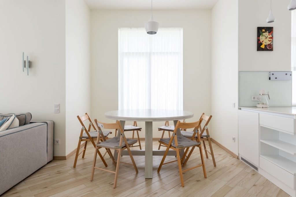 Round dining table with chairs in a compact apartment