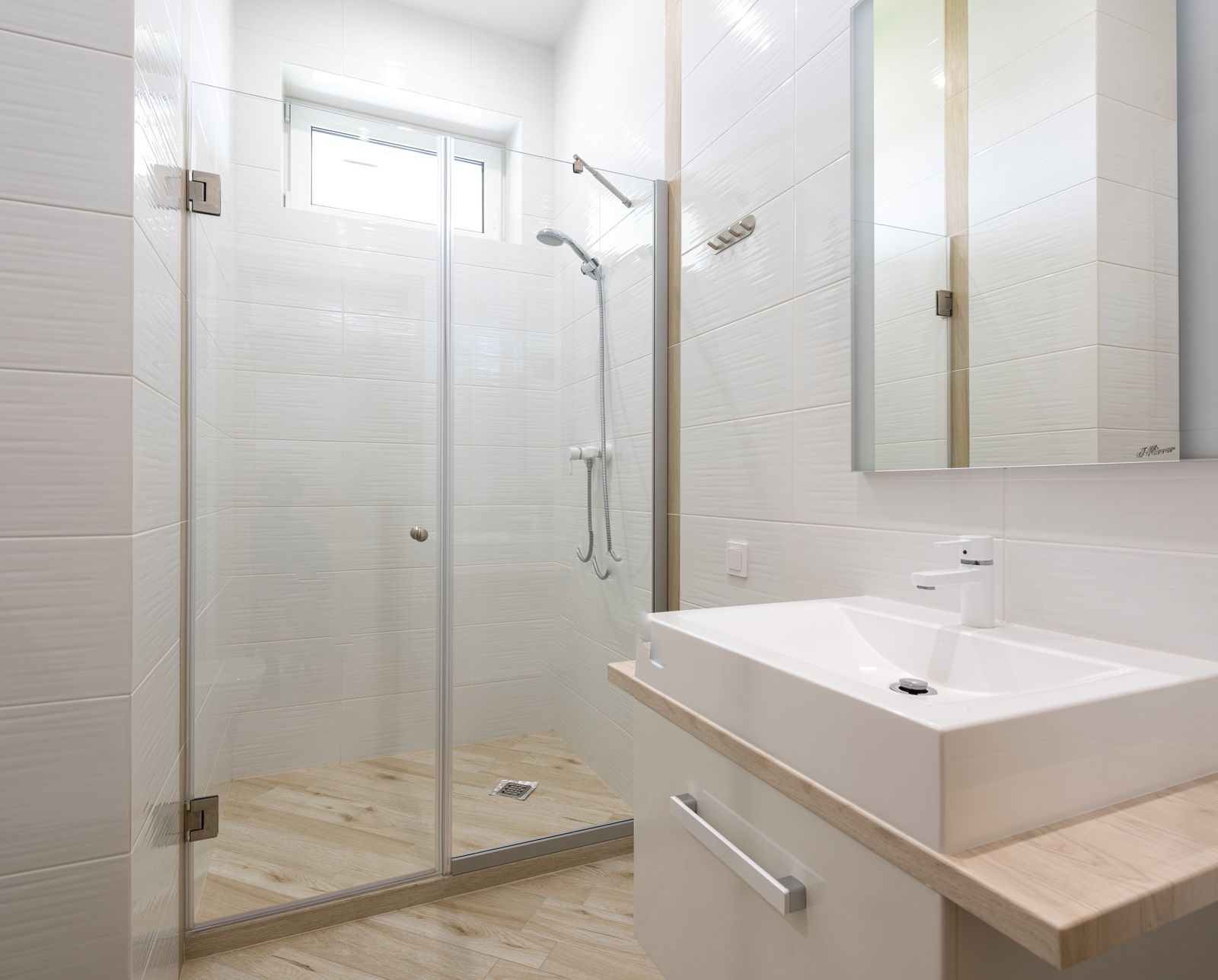 Modern bathroom with a glass shower cabin