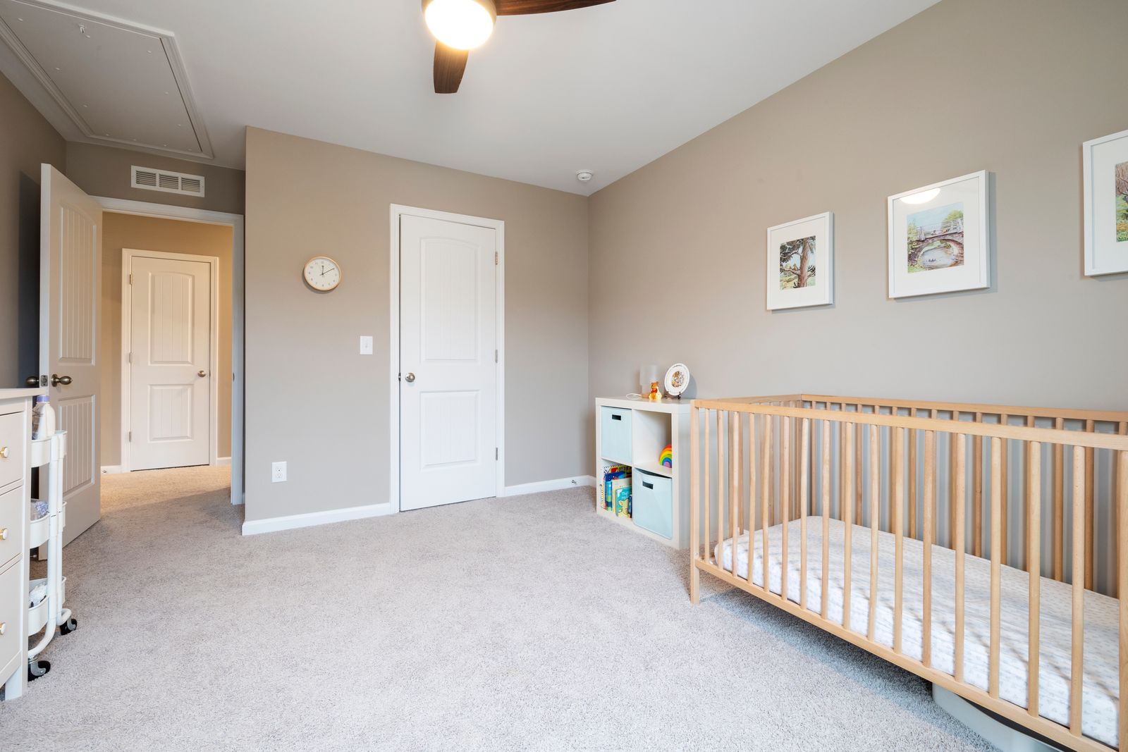 A bright nursery with a wooden crib
