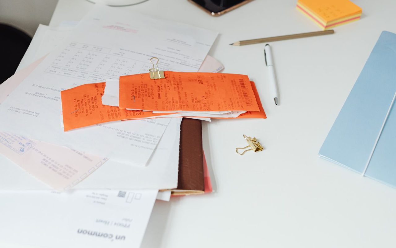 Tidy desk with receipts and household documents