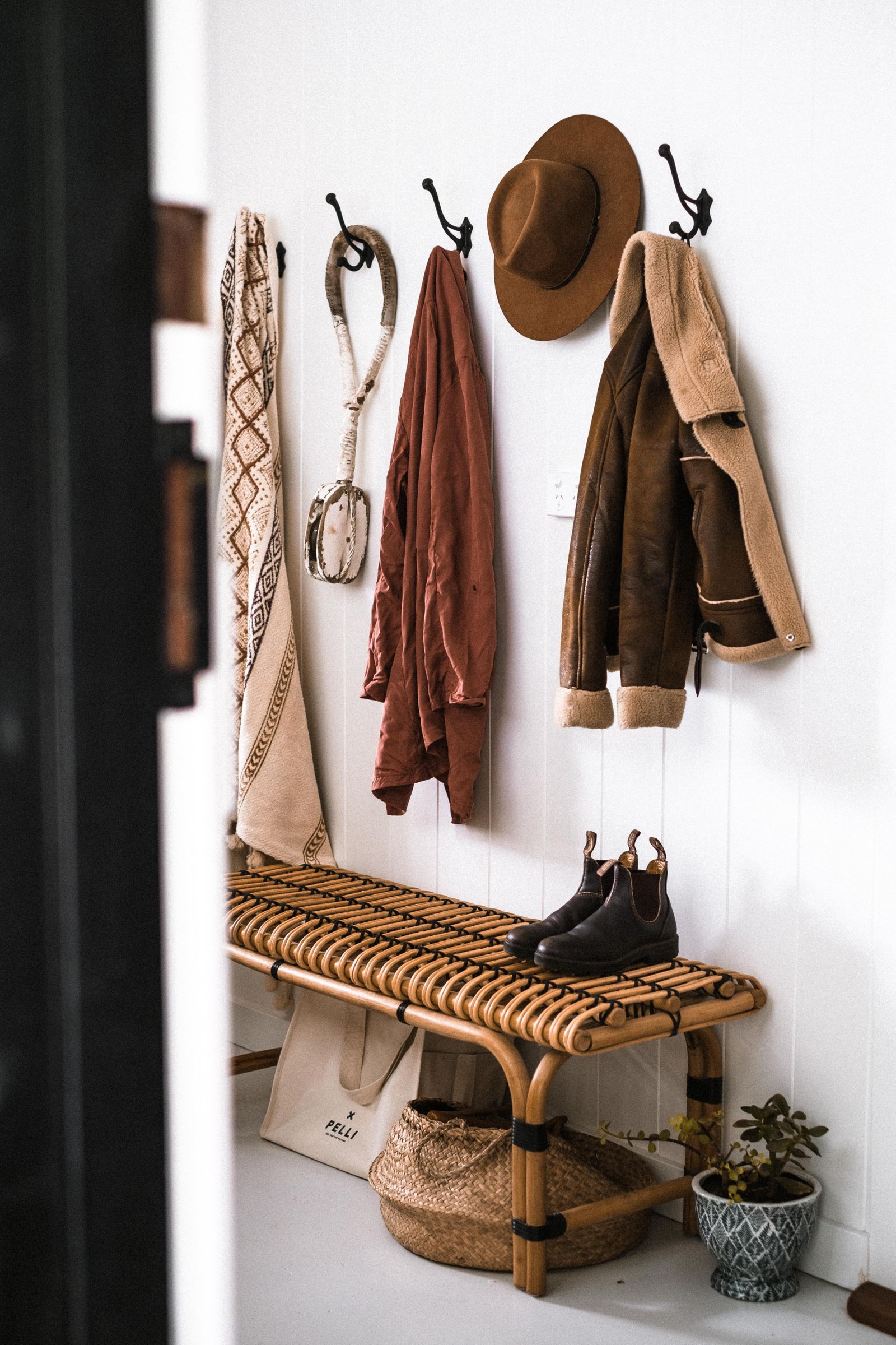 Brown coat hanging on a wall