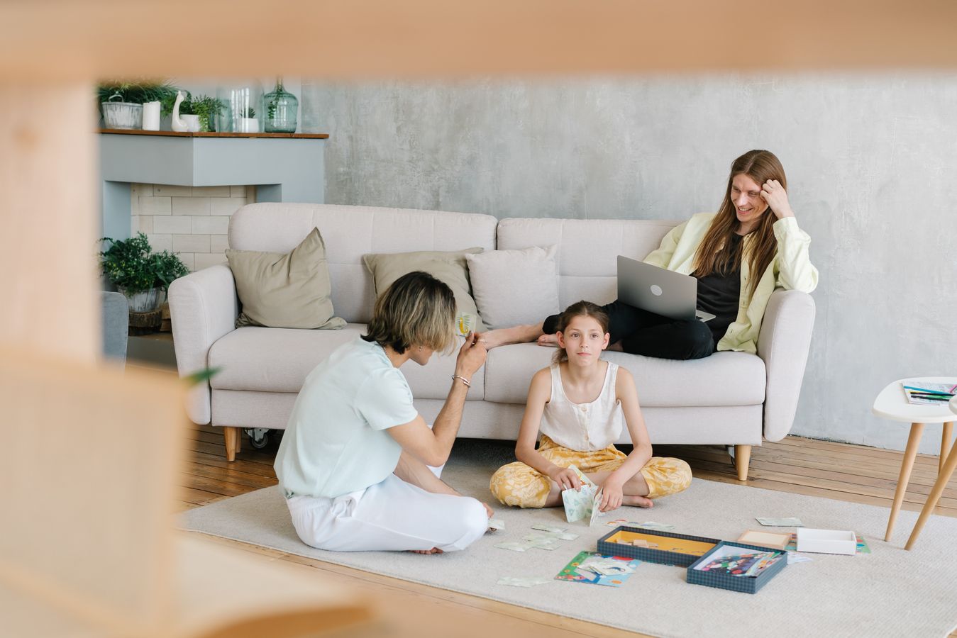 Family spending time together in a cozy living room with open shared space