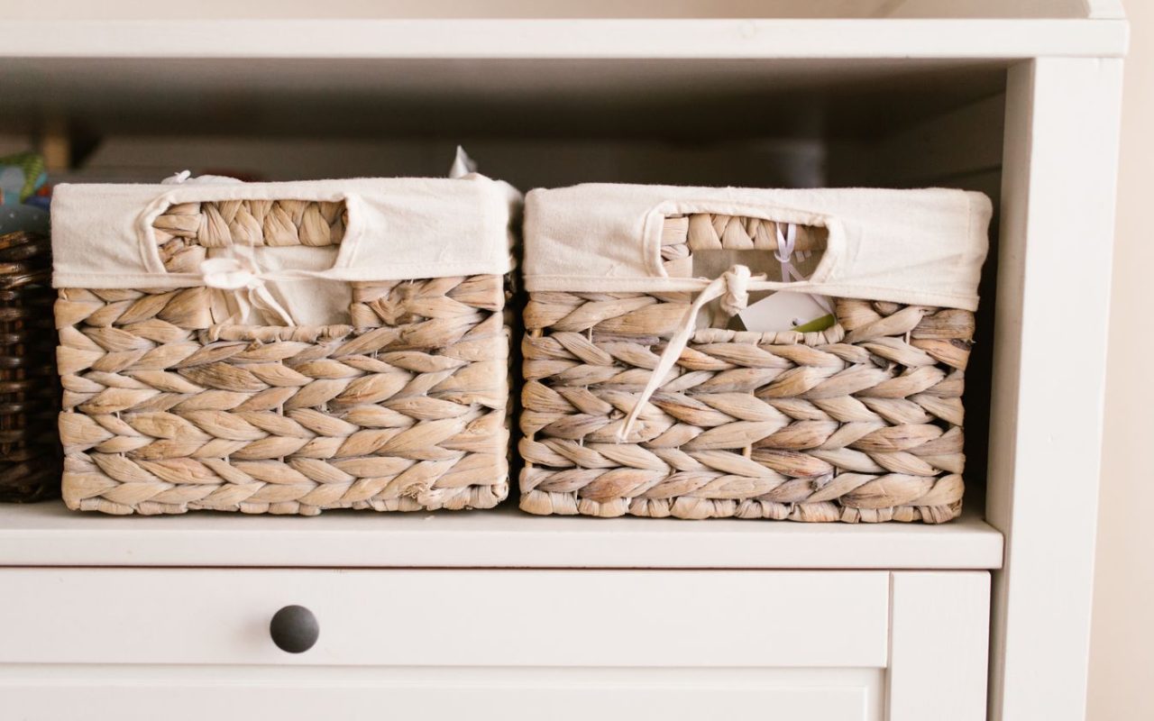 Woven baskets arranged on shelves as practical small-home storage