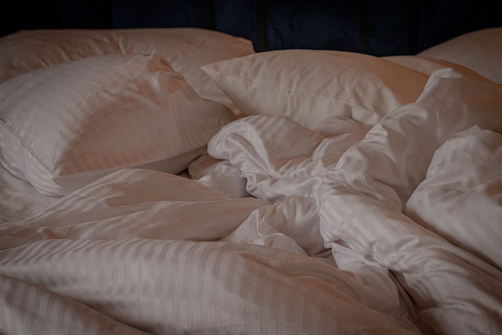 White bed linen and pillows