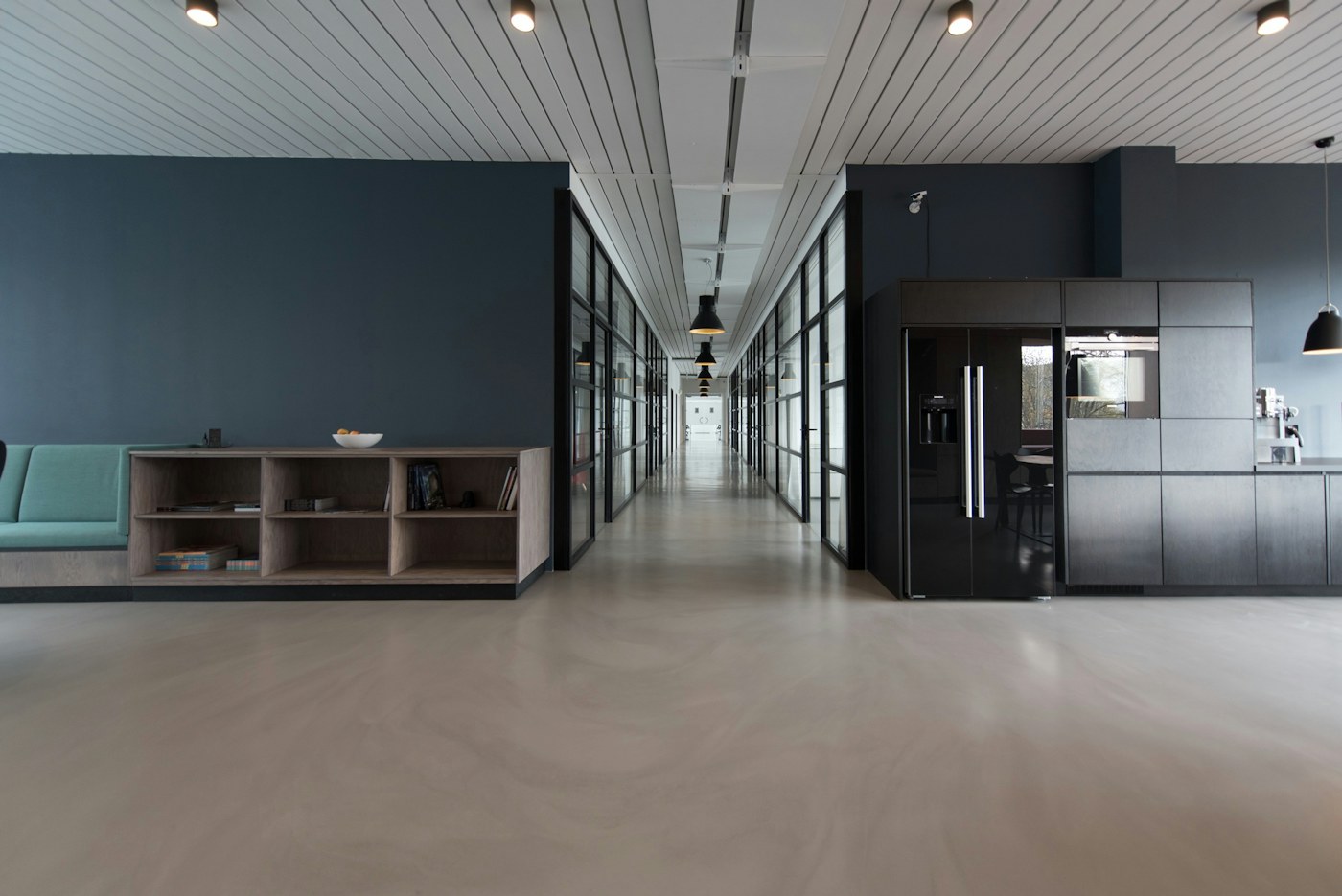 Compact office where mobile storage can park beside the desk