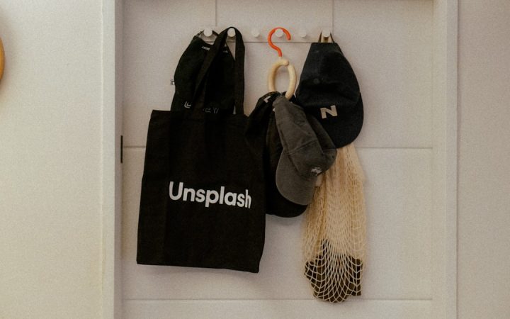 Daily bag and caps stored visibly on hooks for quick departure