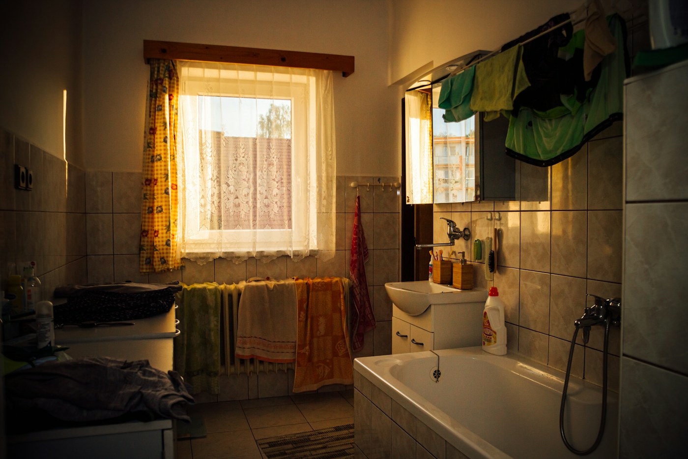Bathroom with hanging textiles illustrating the importance of a drying route