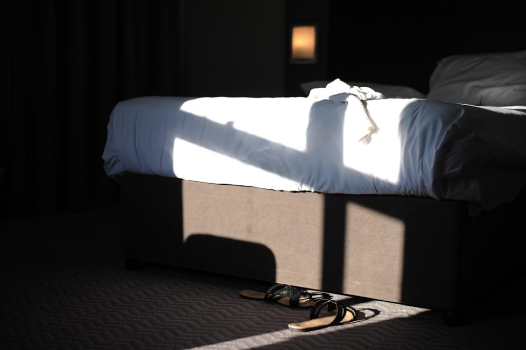 Bed with accessible under-bed area suitable for clearly labeled storage