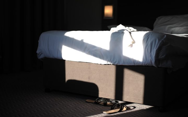 Bed with accessible under-bed area suitable for clearly labeled storage