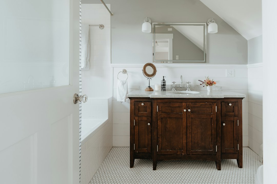 Compact bathroom vanity illustrating limited storage around the sink