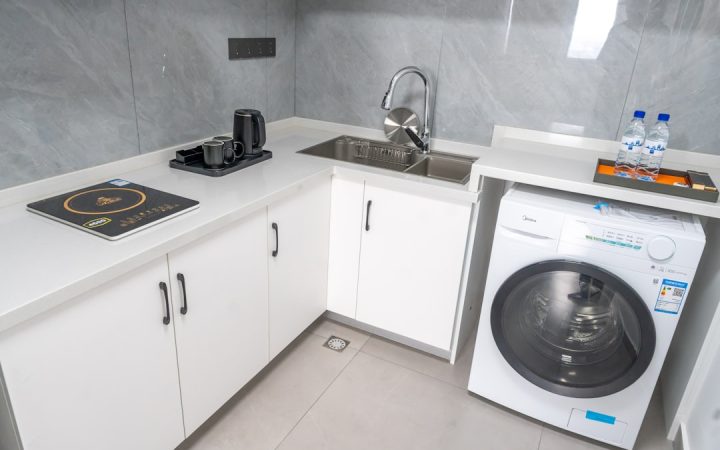 Washing machine integrated into a small kitchen and utility area