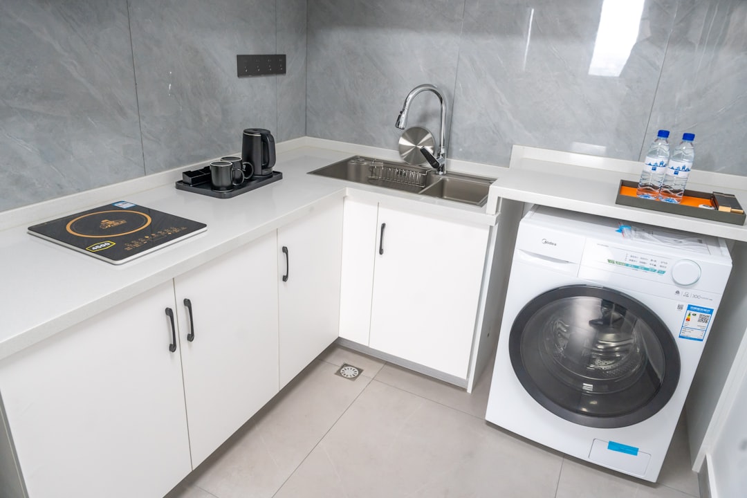 Washing machine integrated into a small kitchen and utility area