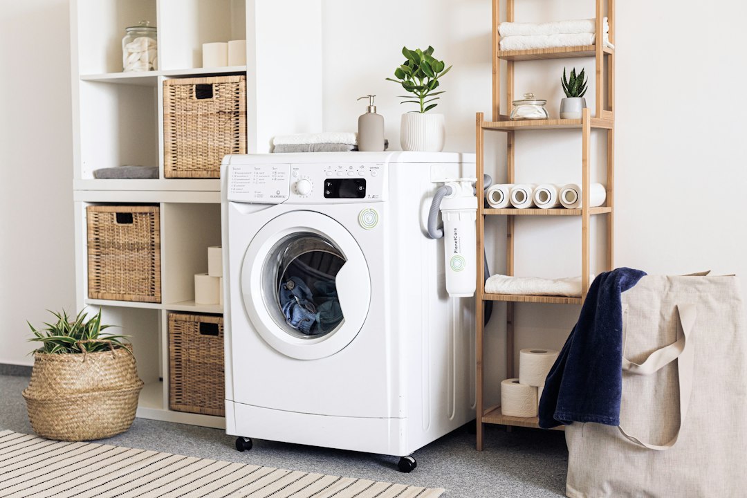 Front-load washing machine in a compact laundry space with usable surrounding area