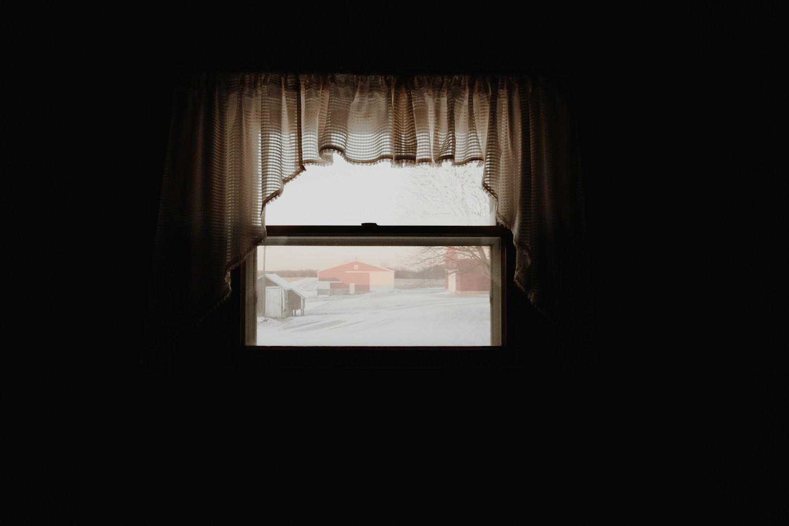 Short curtain framing a small window