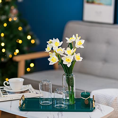 Clear HEWORY bud vases grouped with flowers on a dining table