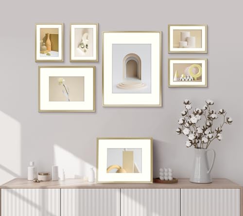 Seven gold Frametory frames arranged above a tabletop