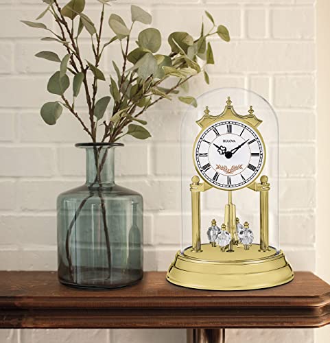 Bulova Heather clock styled on a shelf with a separate vase and foliage