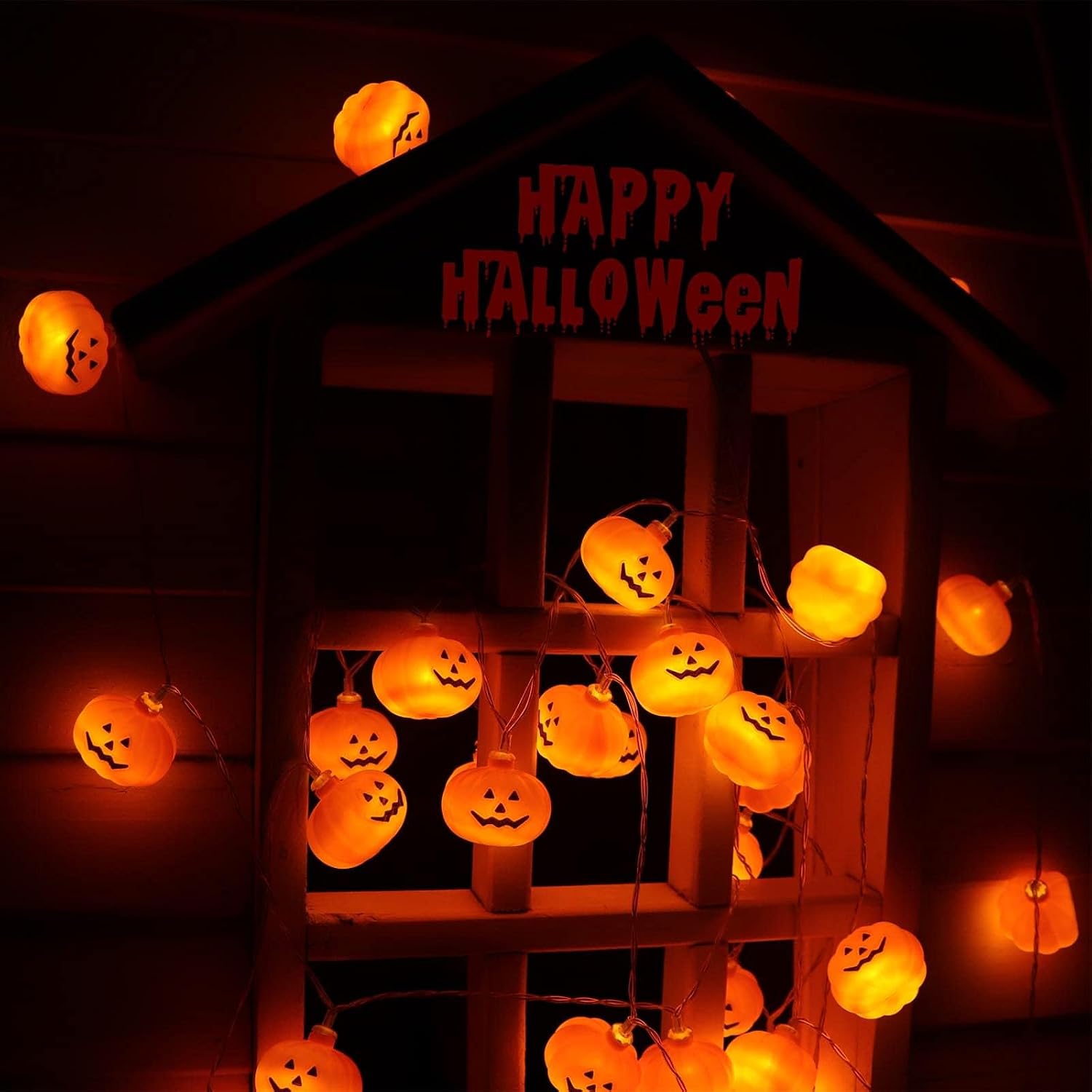 Pumpkin lights arranged on a small display structure