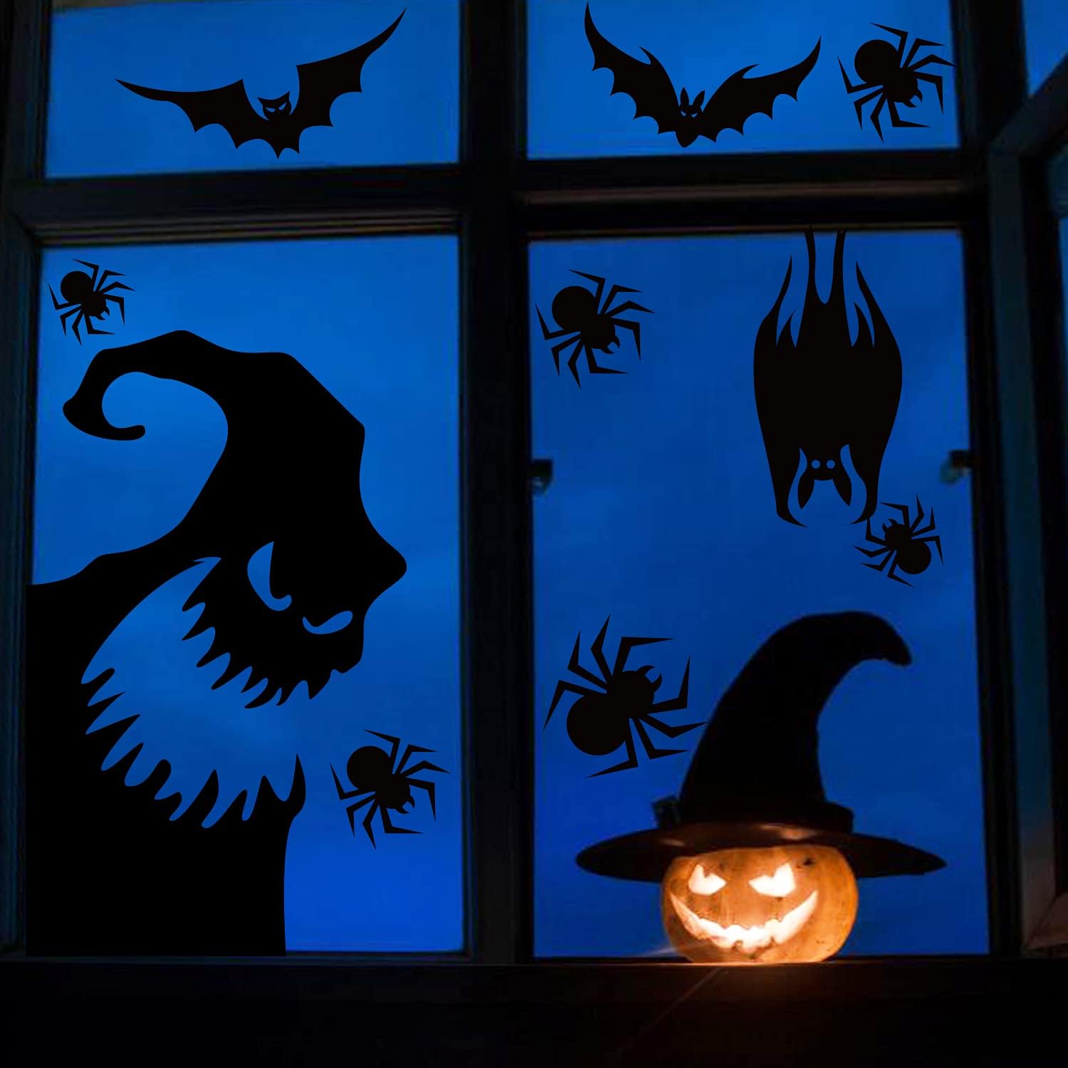 Black silhouettes in an evening window styling scene