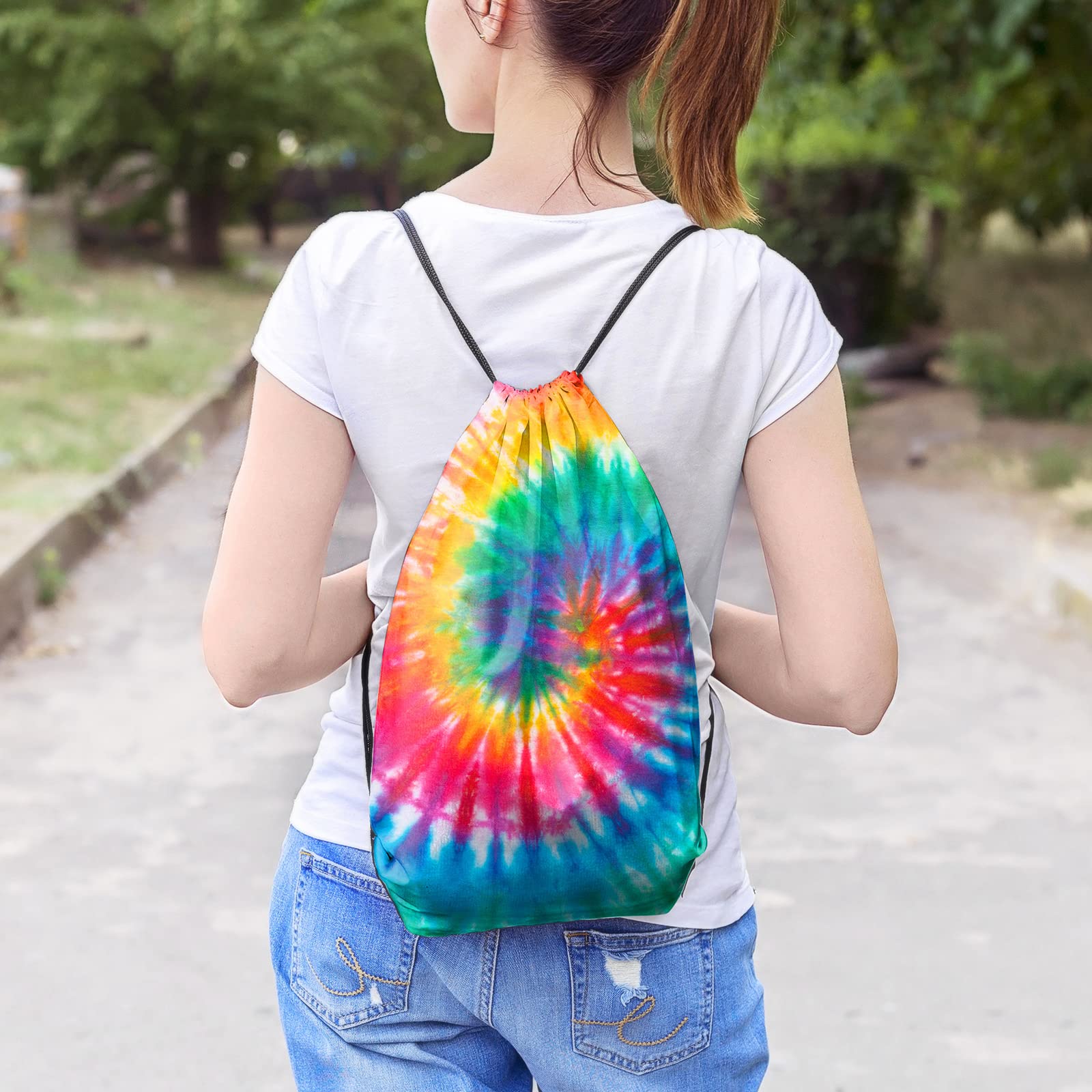 Illustrative tie-dyed Saintrygo-style bag worn as a drawstring backpack; dye is separate