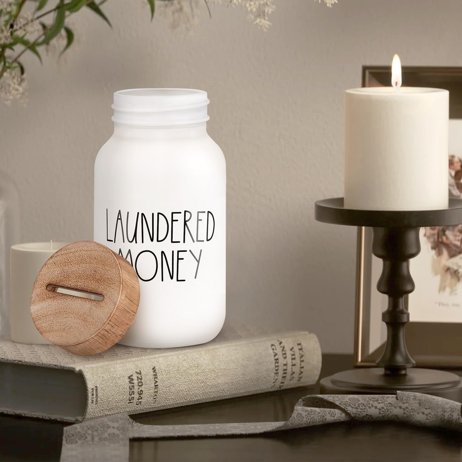 Open painted-glass jar with removed wooden slot lid beside separate decor