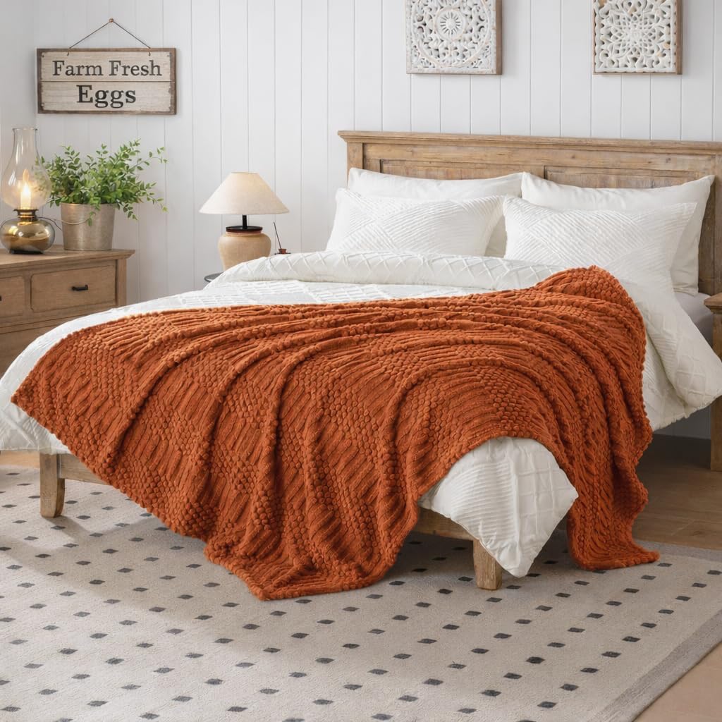 Lussena throw arranged across part of a bed