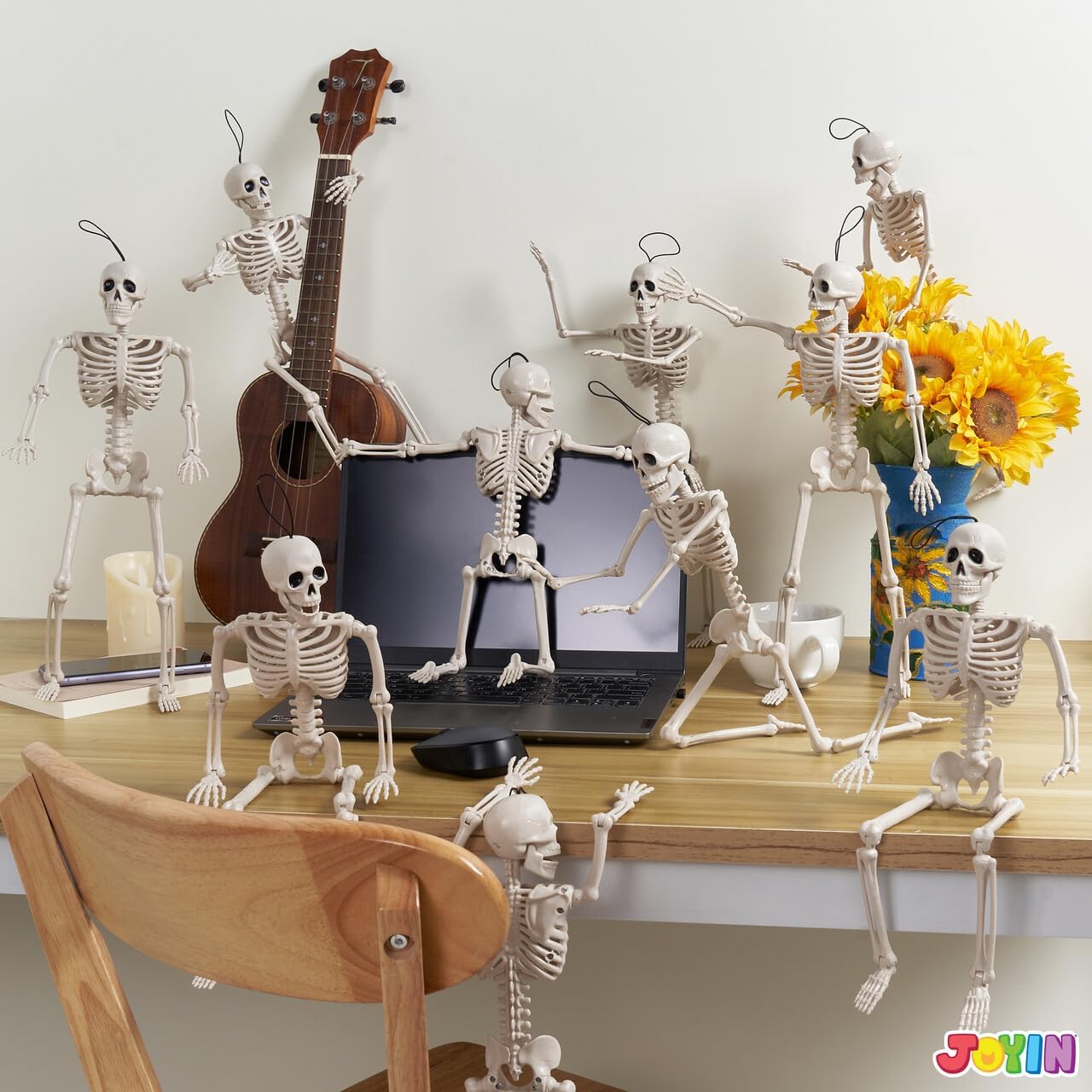 Mini skeletons in a listing Halloween display