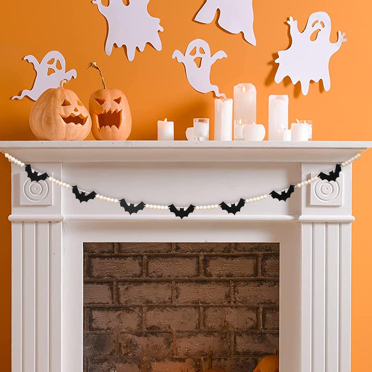 Bat garland in a listing mantel styling scene