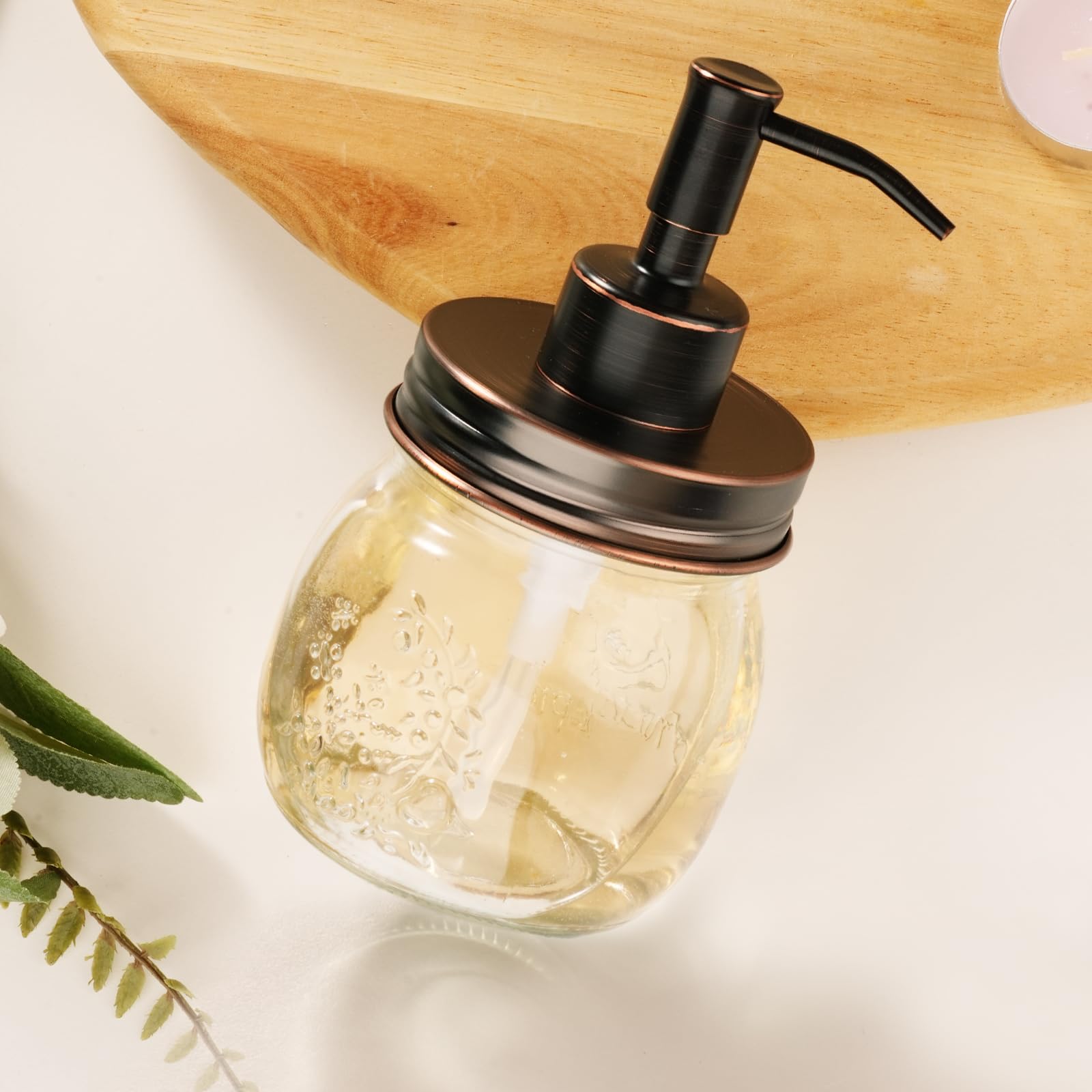 Close angled view of Amolliar glass jar and dark pump