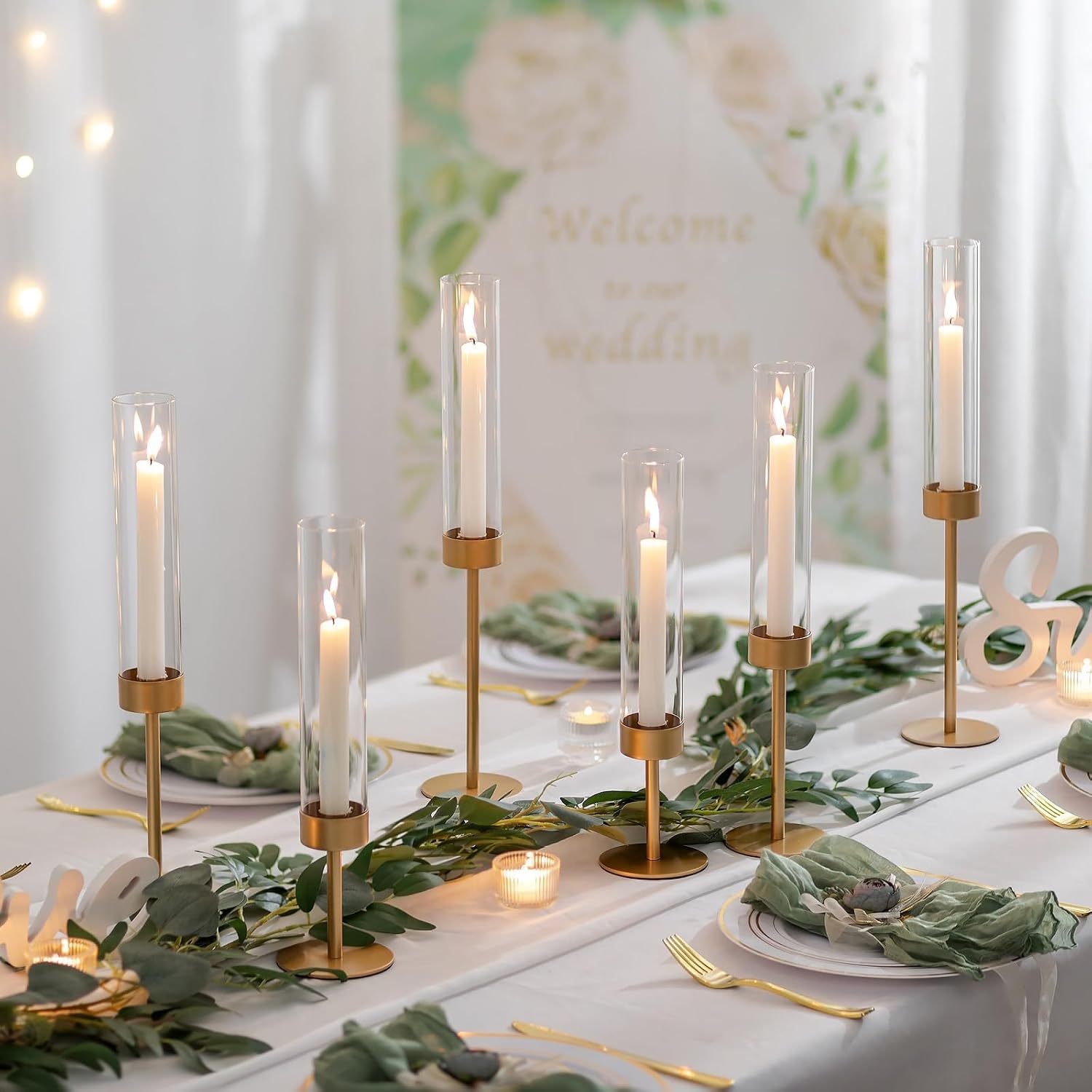 Supplier styled dinner table with glass-covered gold holders