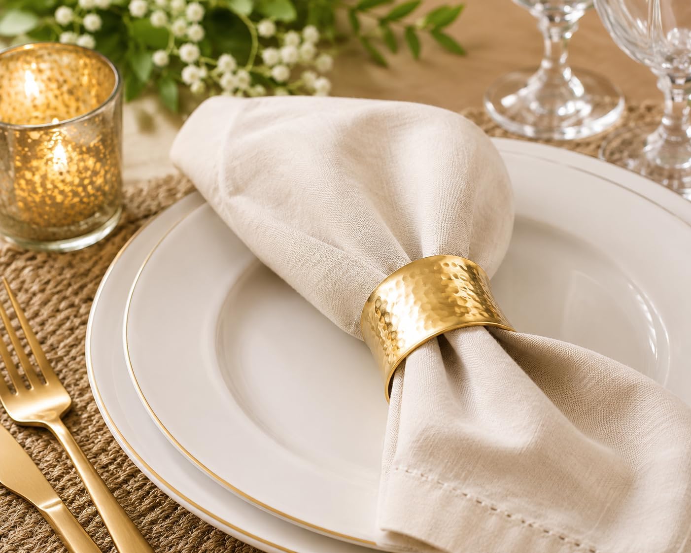 Metal napkin ring on a styled dinner place setting