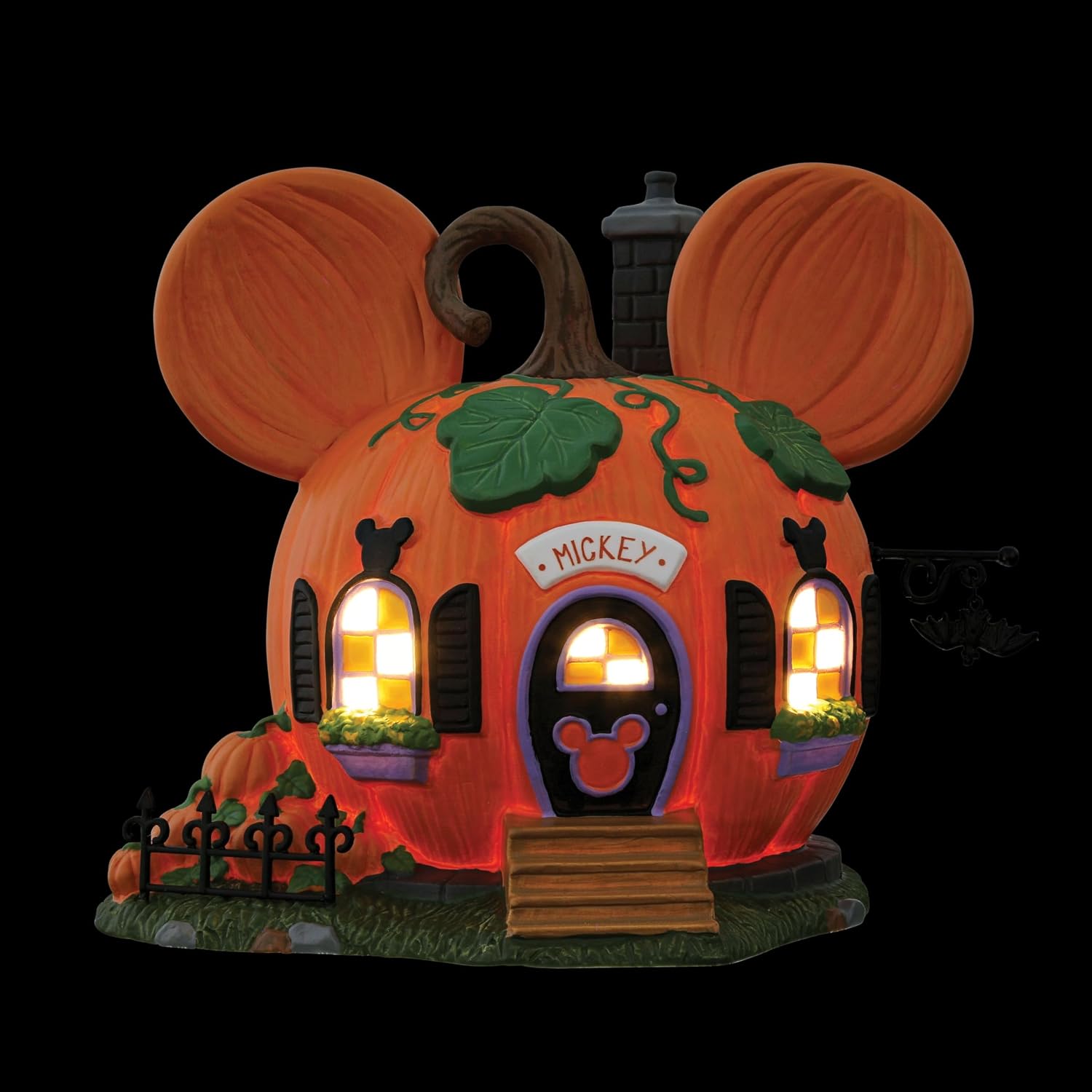 Illuminated windows of the Mickey Pumpkintown house